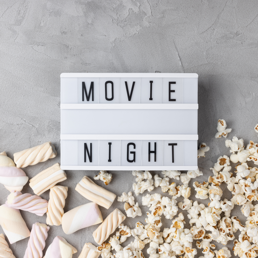 movie night sign with popcorn and candy