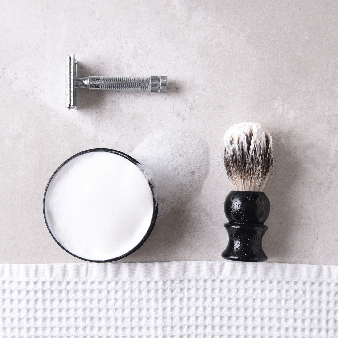 safety razor with shaving cream and brush